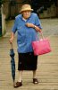 grim-old-lady-with-an-umbrella-and-bag-X4K3TA_edited.jpg
