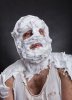 bizarre-man-face-completely-shaving-foam-thinks-over-grey-52007855.jpg