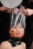 meanwhile-in-japan-goldfish-in-a-bag-around-a-womans-head.jpg